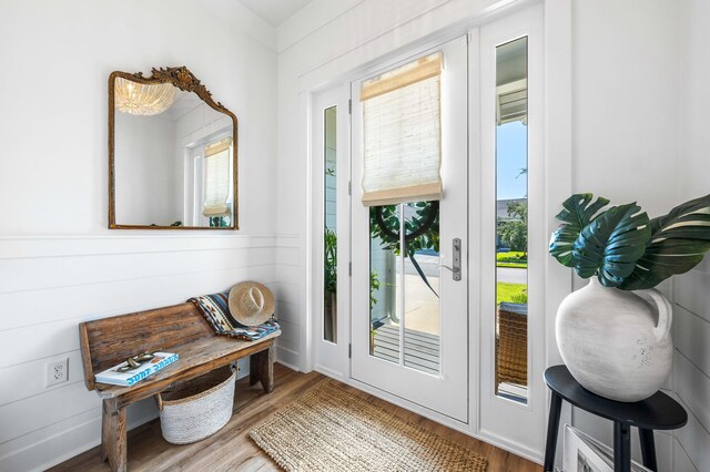 doorway with hardwood / wood-style floors