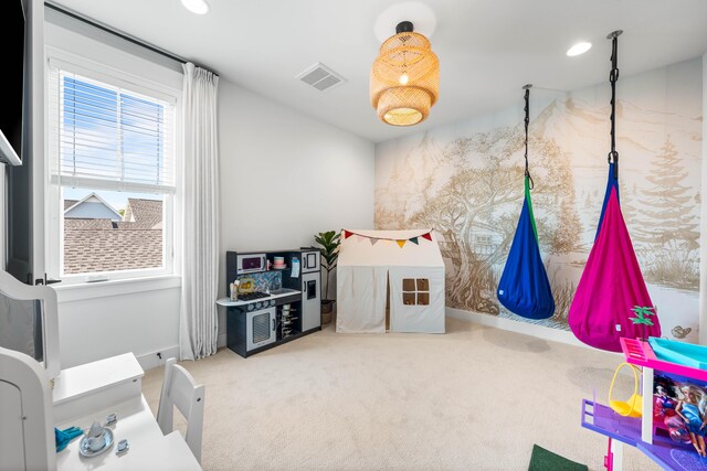 recreation room featuring carpet flooring