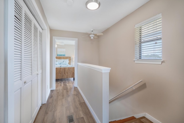 hall with light hardwood / wood-style floors