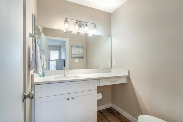 bathroom featuring vanity and wood-type flooring