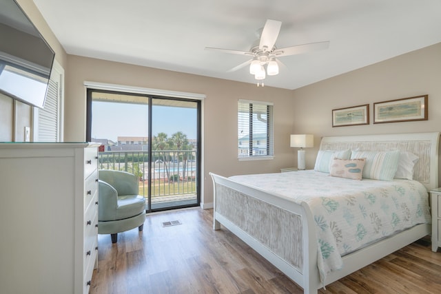 bedroom with access to outside, ceiling fan, and light wood-type flooring