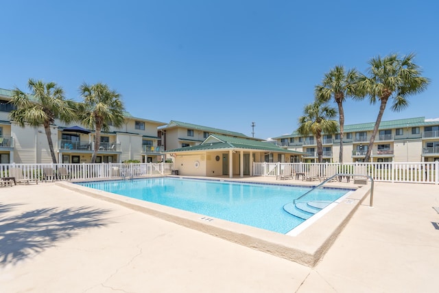 view of swimming pool with a patio