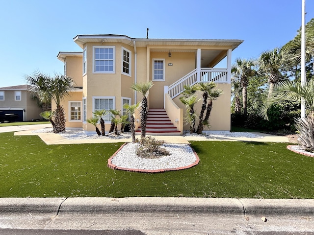 view of front of house with a front lawn