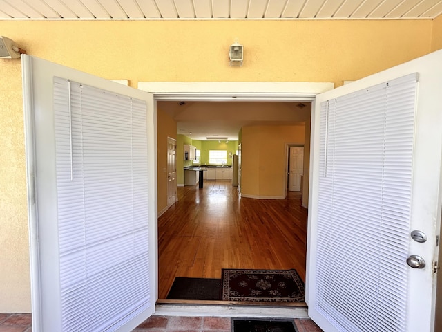 hallway with wood-type flooring