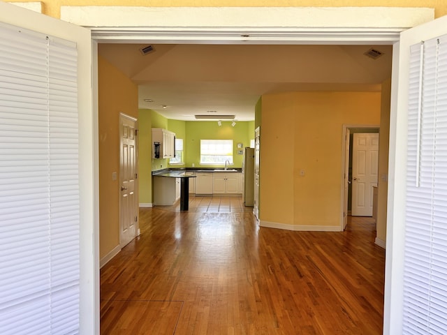 interior space featuring hardwood / wood-style flooring and sink