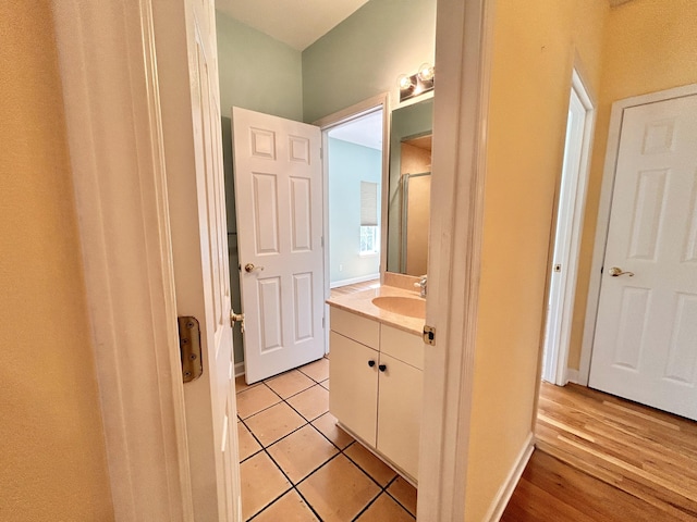 bathroom with vanity and tile patterned floors