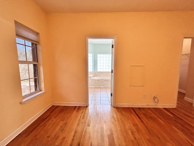 spare room featuring light wood-type flooring