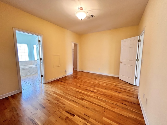 spare room featuring light wood-type flooring