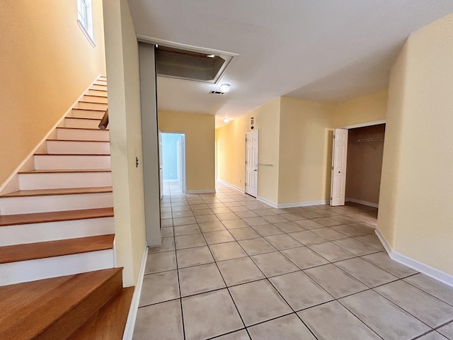 stairs featuring tile patterned floors