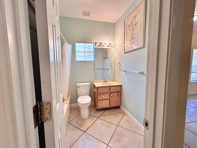 bathroom featuring vanity, toilet, and tile patterned flooring