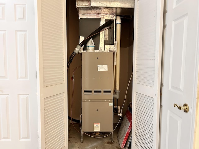 utility room with heating unit