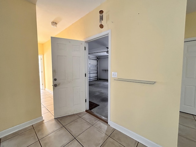 corridor featuring light tile patterned floors