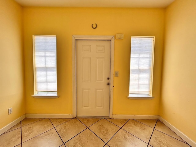 tiled foyer entrance featuring plenty of natural light