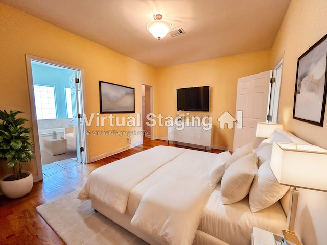 bedroom featuring hardwood / wood-style floors