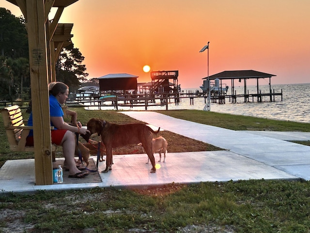 view of property's community with a gazebo and a water view