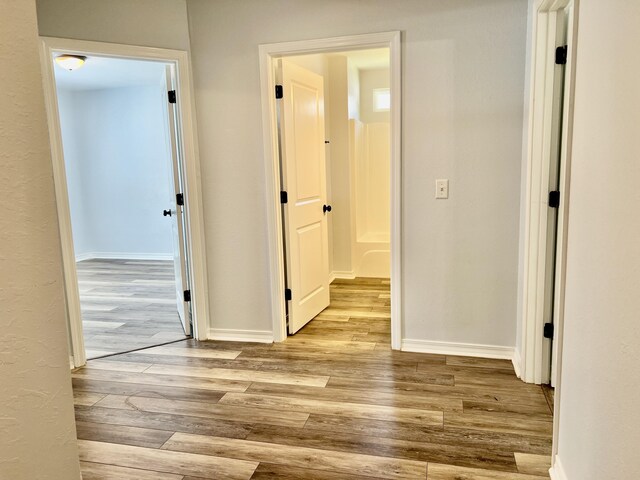 hallway featuring light wood-type flooring