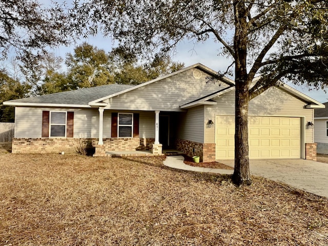 ranch-style house with a garage and covered porch