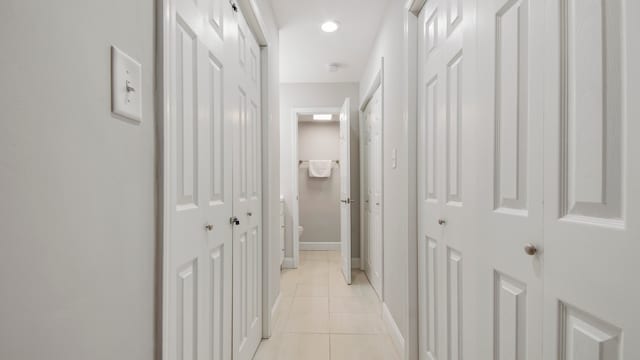 hallway with light tile patterned floors