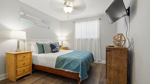 bedroom featuring ceiling fan and dark hardwood / wood-style flooring