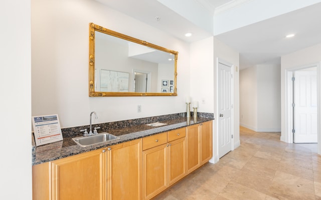 bathroom featuring dual bowl vanity and tile patterned flooring