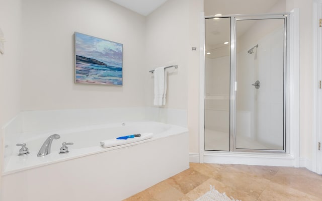 bathroom with tile patterned flooring and independent shower and bath