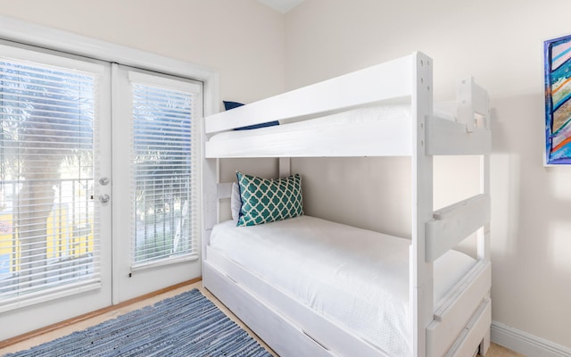 bedroom with access to exterior and french doors