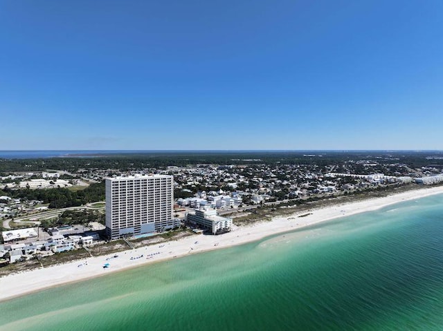 drone / aerial view featuring a water view and a beach view