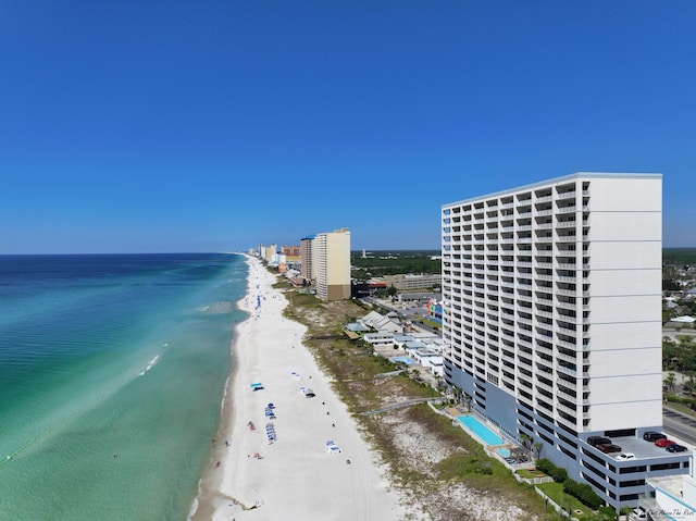 birds eye view of property featuring a view of the beach and a water view