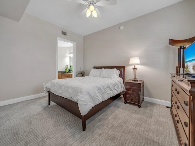 bedroom with light colored carpet, visible vents, and baseboards