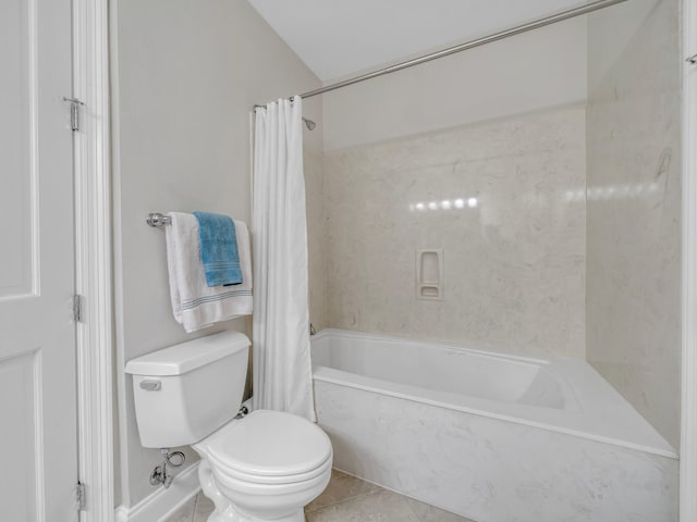 full bath with tile patterned flooring, shower / tub combo with curtain, and toilet