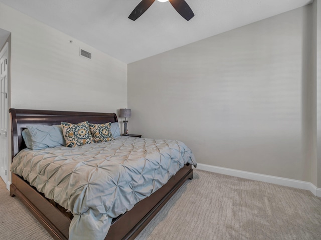 bedroom with carpet, visible vents, vaulted ceiling, and baseboards