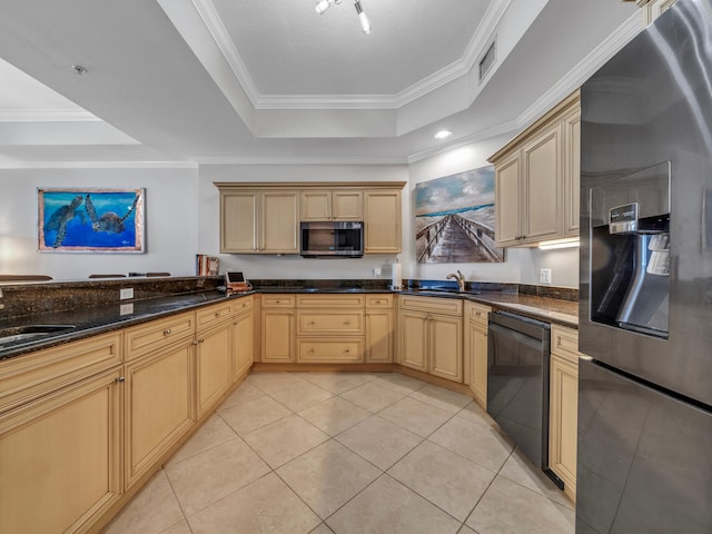 kitchen featuring light tile patterned floors, stainless steel appliances, a sink, and a raised ceiling