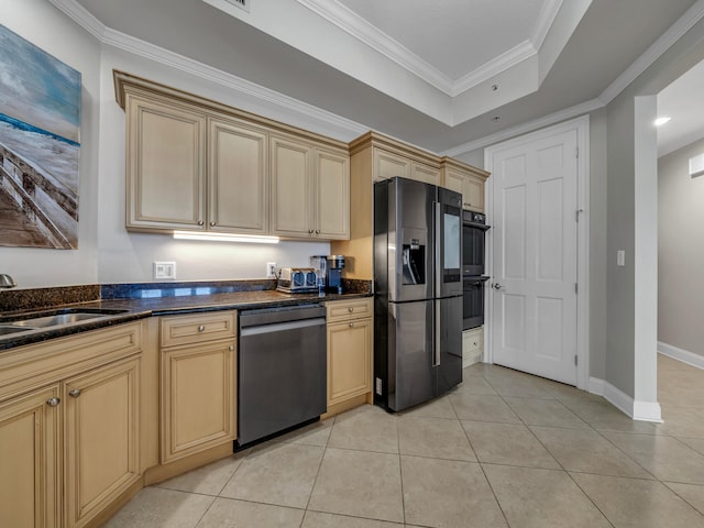 kitchen with a sink, crown molding, black appliances, and light tile patterned floors