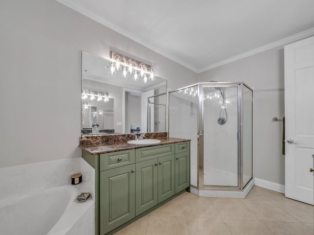 bathroom featuring ornamental molding, a shower stall, and vanity