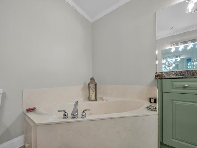 bathroom with ornamental molding, a garden tub, and vanity