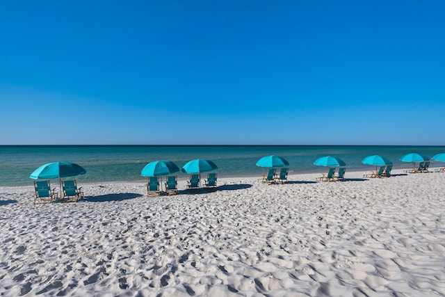 property view of water featuring a beach view