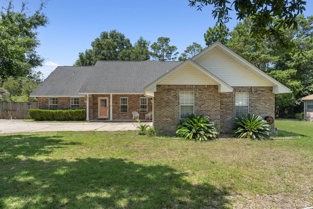 ranch-style home with a front lawn