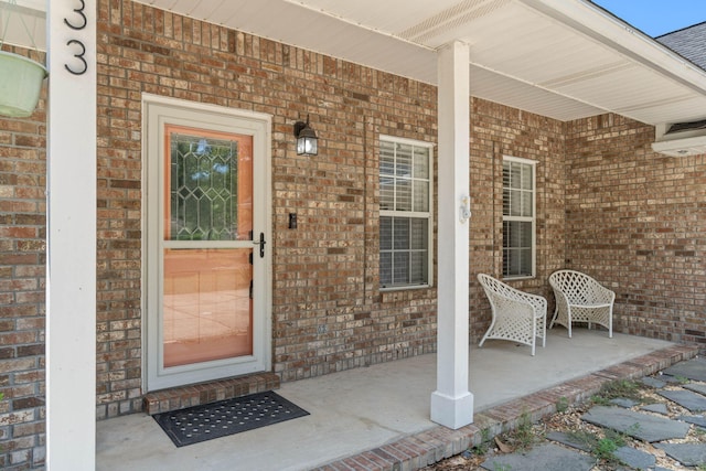 doorway to property with a porch