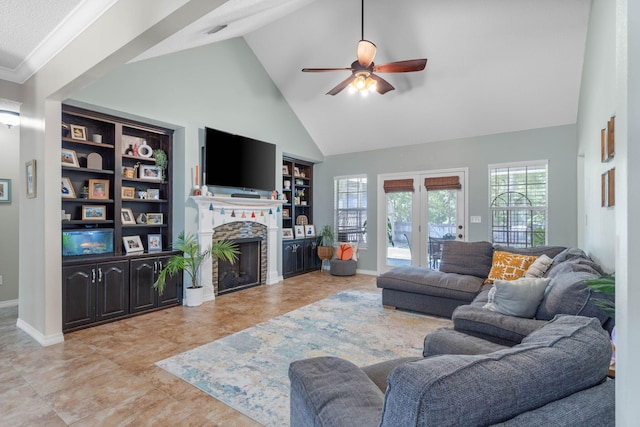 living room with light tile patterned floors, high vaulted ceiling, built in features, french doors, and ceiling fan