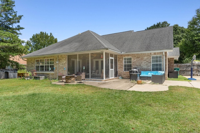 back of property featuring an outdoor living space, a patio area, and a yard