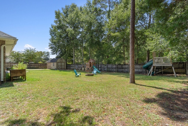 view of yard featuring a shed and a playground