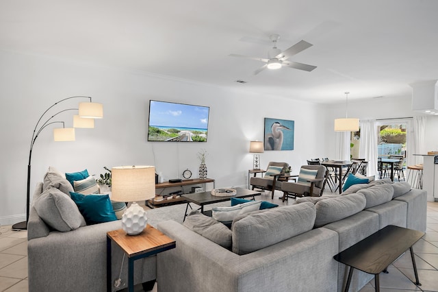 living room featuring light tile patterned floors and ceiling fan