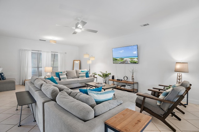 tiled living room featuring ceiling fan