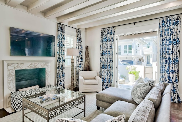 living room with beamed ceiling and hardwood / wood-style floors