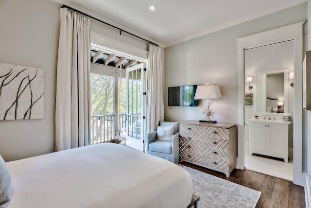 bedroom with dark wood-type flooring and access to exterior