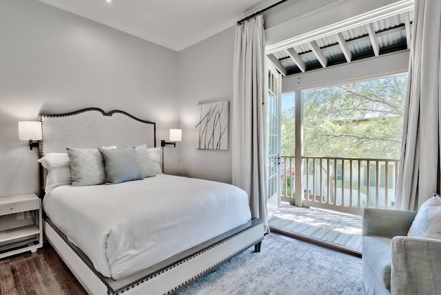 bedroom featuring access to exterior, ornamental molding, and dark wood-type flooring