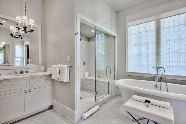 bathroom with independent shower and bath, ornamental molding, a notable chandelier, and vanity