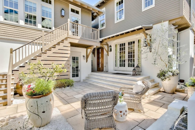 rear view of property with a patio area and french doors