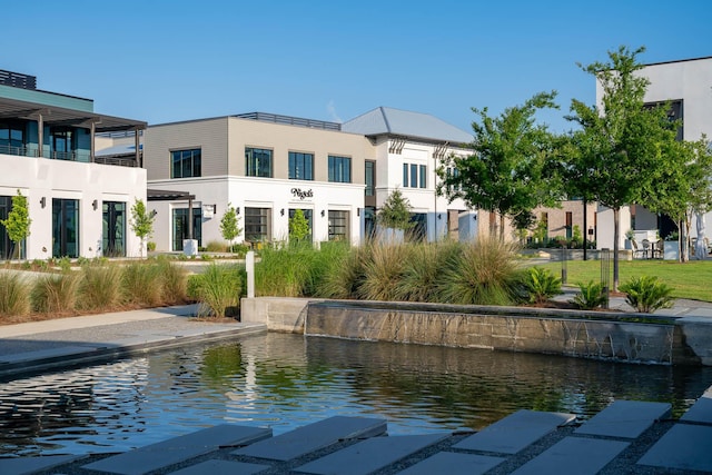 exterior space with a water view