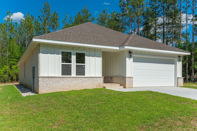 single story home with a garage and a front yard